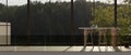 A modern corridor in the building with a table against the glass wall with an amazing nature view Royalty Free Stock Photo