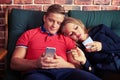 Modern couple is addicted to social networking with cell phones