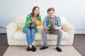 Soccer world cup concept - Modern couple looking excited and happy watching sport game on tv Royalty Free Stock Photo