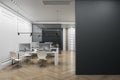 Modern coworking office interior with empty mock up place on wall, furniture, wooden flooring, concrete walls, equipment and Royalty Free Stock Photo