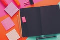 Modern creative work space with stylish black notepad Royalty Free Stock Photo