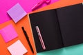 Modern creative work space with stylish black notepad Royalty Free Stock Photo