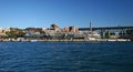 Modern cruise ship terminal, heritage industrial brick buildings with smoke chimney in historic Rocks at Sydney harbor