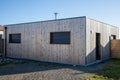 modern cube little wooden house square facade contemporary home extension from street Royalty Free Stock Photo