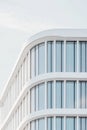 Modern curved glass building with minimalist architecture Royalty Free Stock Photo