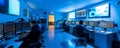 Modern Cybersecurity Operations Center with Professionals Monitoring Multiple Computer Screens in Blue Lighting