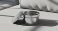 Sleek Silver Metallic Tin Container with Open Lid on Grey Background Royalty Free Stock Photo