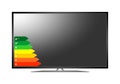 Modern 3D plasma TV. Off multimedia device with a stand with a black display with energy class label from efficiency A to D on whi Royalty Free Stock Photo