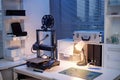 Modern 3d Printer Operating on Desk in Contemporary Engineering Workspace Royalty Free Stock Photo