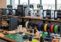 A modern 3D printing lab features multiple 3D printers arranged on Royalty Free Stock Photo
