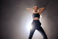 Modern dance. Hip-hop female dancer dancing in stylish casual wear, isolated Royalty Free Stock Photo