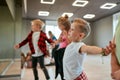 Modern dancers. Group of fashionable children learning a modern dance while having a choreography class. Dance studio