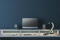 Modern dark designer workplace with empty mock up computer screen, loud speakers and other items. 3D Rendering
