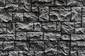 Modern dark brick wall. Pattern of decorative stone wall background. Surface black wall texture Royalty Free Stock Photo