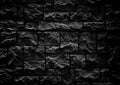 Modern dark brick wall. Pattern of decorative stone wall background. Surface black wall texture Royalty Free Stock Photo