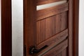 MODERN WOODEN DOOR WITH METAL HANDLE Royalty Free Stock Photo