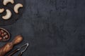 Vanilla cookies on a cooling grid with hazelnuts, nutcracker and wooden dough roller on a concrete background. Royalty Free Stock Photo