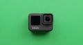 GoPro Action Camera on a Vibrant Green Background Royalty Free Stock Photo