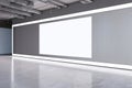 Modern grunge concrete exhibition hall interior with blank white mock up canvas on wall. 3D Rendering Royalty Free Stock Photo