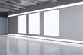 Modern grunge concrete exhibition hall interior with empty white mock up billboards on wall. 3D Rendering Royalty Free Stock Photo