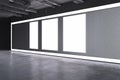 Modern grunge concrete exhibition hall interior with empty white mock up posters on wall. 3D Rendering Royalty Free Stock Photo