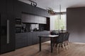 Modern dark kitchen and dinning room interior with furniture and kitchenware, grey, black and dark wood kitchen interior Royalty Free Stock Photo