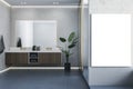 Modern wooden and concrete bathroom interior with empty mock up banner on wall, mirror, counter and sink. Hotel and home