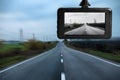 Modern dashboard camera mounted in car, view of road during driving