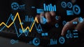 Modern Data Analysis with Interactive Graphs and Charts Displayed Over a Keyboard in a Futuristic Office Environment Royalty Free Stock Photo