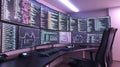 Modern data analytics workspace with multiple monitors displaying code and graphs in a tech-centric environment Royalty Free Stock Photo