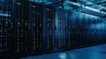 A modern data center with rows of black server racks illuminated by blue lights. The environment is high-tech and Royalty Free Stock Photo