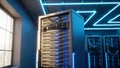 Modern data center server rack with glowing lights in high-tech facility Royalty Free Stock Photo
