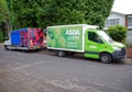 Competing online supermarket delivery vans. Woodham, Surrey.