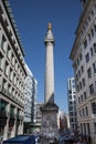 Modern-day View of the Monument to the Great Fire of London fluted Doric column built of Portland stone topped with a gilded urn