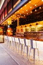 Modern decorated beer tap Counter bar with empty seats in evening