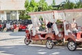 Modern decorated rickshaw on the road. Travel concept