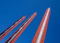 Modern decorative architectural metal post statue against blue sky 2