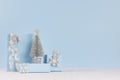 Modern delicate christmas background with copy space - silver tree and various festive gift boxes with sparkles ribbons in soft.