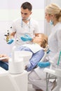 Modern dental clinic, young dentist working Royalty Free Stock Photo