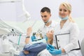 Modern dental clinic, young dentist working Royalty Free Stock Photo