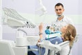 Modern dental clinic, young dentist working Royalty Free Stock Photo