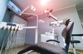 Modern dentistry office interior with chair and tools.