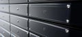 Modern Deposit Boxes in Shades of Gray, Featuring Shiny Surfaces and Individual Lockers for Security Royalty Free Stock Photo