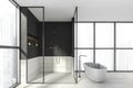 Modern design bathroom interior with shower cabin, white oval bathtub, faucets. Panoramic window with skyscrapers city view. Wood Royalty Free Stock Photo