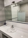 Modern design bathroom. Large modern bathroom interior with floor to ceiling tiling and luxury fittings