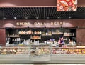 Modern design of the gastronomic section with various meat products, cheeses and salads