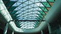 Modern design of the glass roof of the shopping center, inside view. Futuristic, Abstract building design, modern architecture