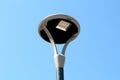 Modern design LED street lamp with grey and black metal casing on clear blue sky back Royalty Free Stock Photo