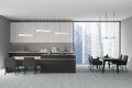 Modern design living dining room and kitchen interior with table, island and concrete flooring. Panoramic window Singapore city Royalty Free Stock Photo
