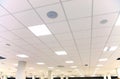 White office ceiling with white tiles and lighting Royalty Free Stock Photo